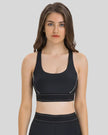 EdgeForm Sports Bra in Black with rounded neckline and contrast detailing shown from the front