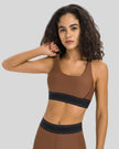 EdgeForm Sports Bra in Chocolate with rounded neckline and contrast detailing shown from the front