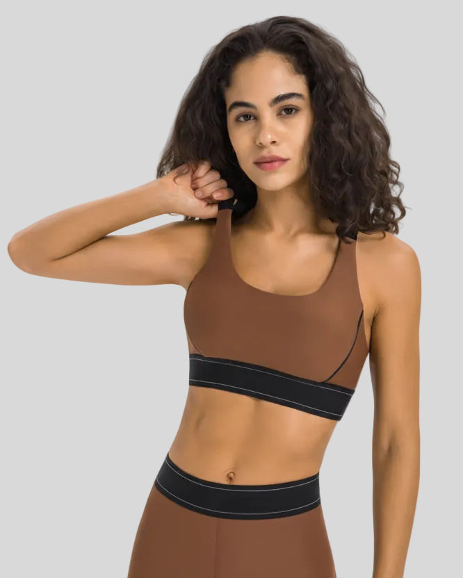 EdgeForm Sports Bra in Chocolate with rounded neckline and contrast detailing shown from the front