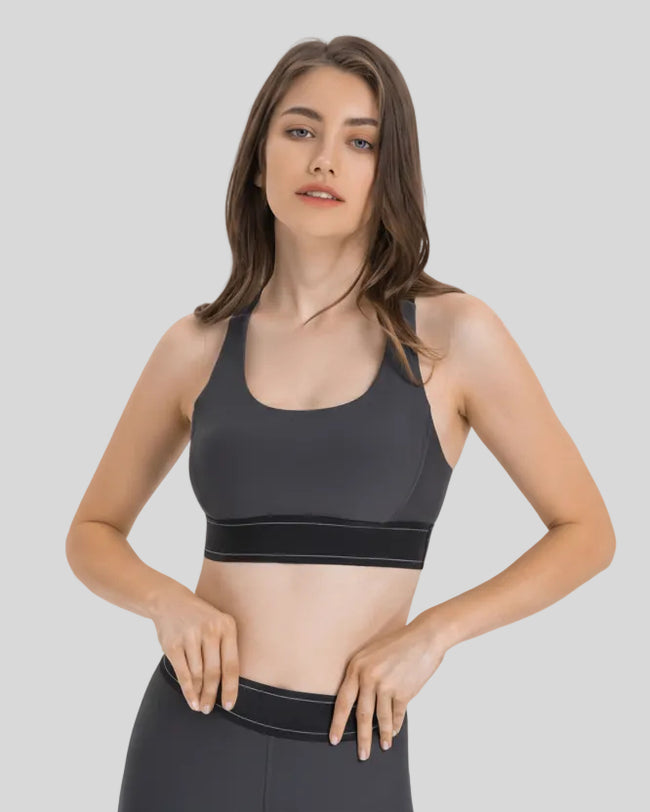 Angled front view of the EdgeForm Sports Bra in Gray highlighting sculpted fit and contrast lines