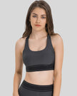 EdgeForm Sports Bra in Gray with rounded neckline and contrast detailing shown from the front