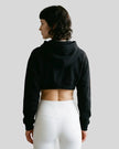 Model wearing Everyday Cropped Hoodie in Black back view