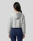 Model wearing Everyday Cropped Hoodie in Flower Gray back view