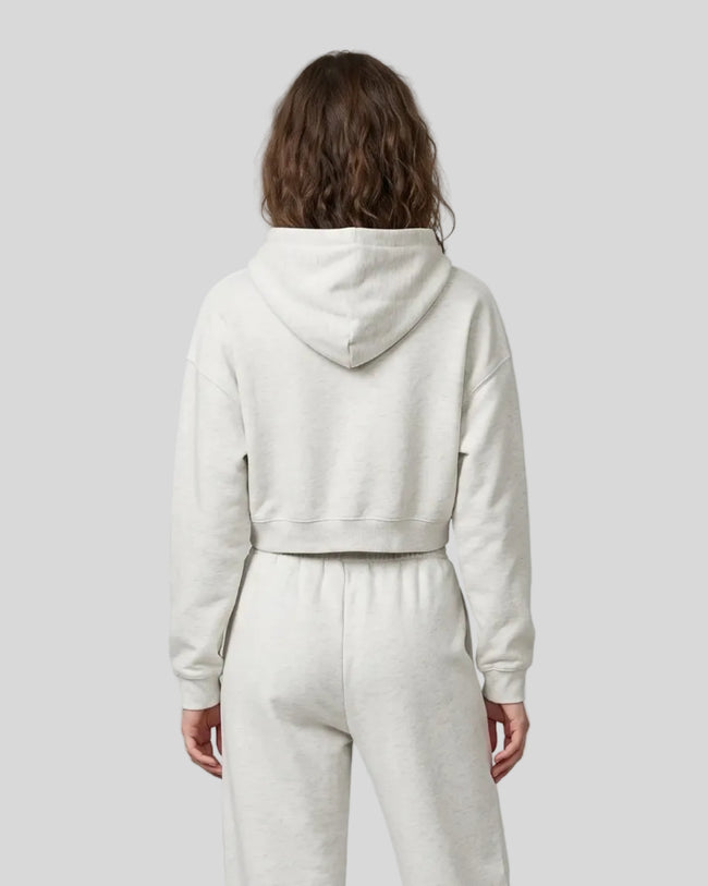 Model wearing Everyday Cropped Hoodie in Oat Gray back view