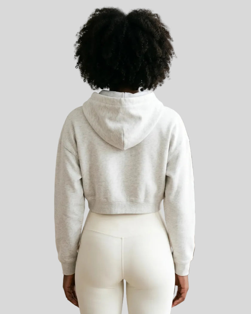 Model wearing Everyday Cropped Hoodie in Oat Gray back view