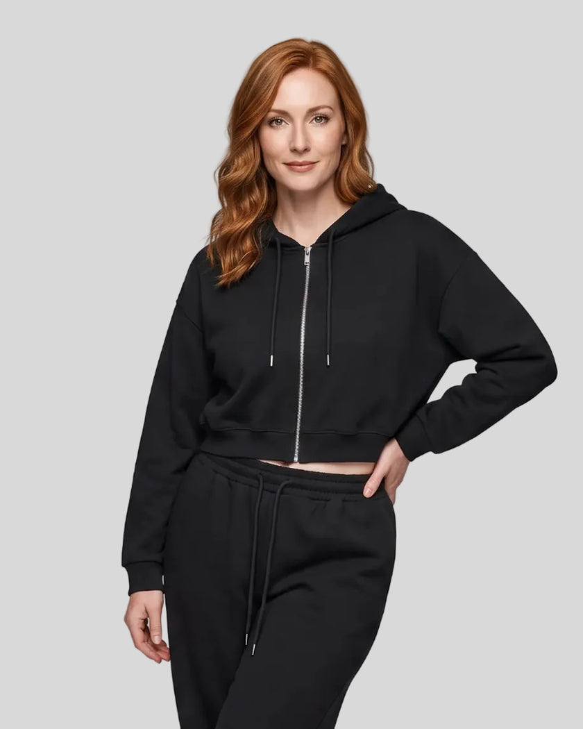 Model wearing the Everyday Cropped Zip-Up Hoodie in Black viewed from the front