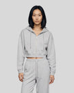 Model wearing the Everyday Cropped Zip-Up Hoodie in Flower Gray viewed from the front
