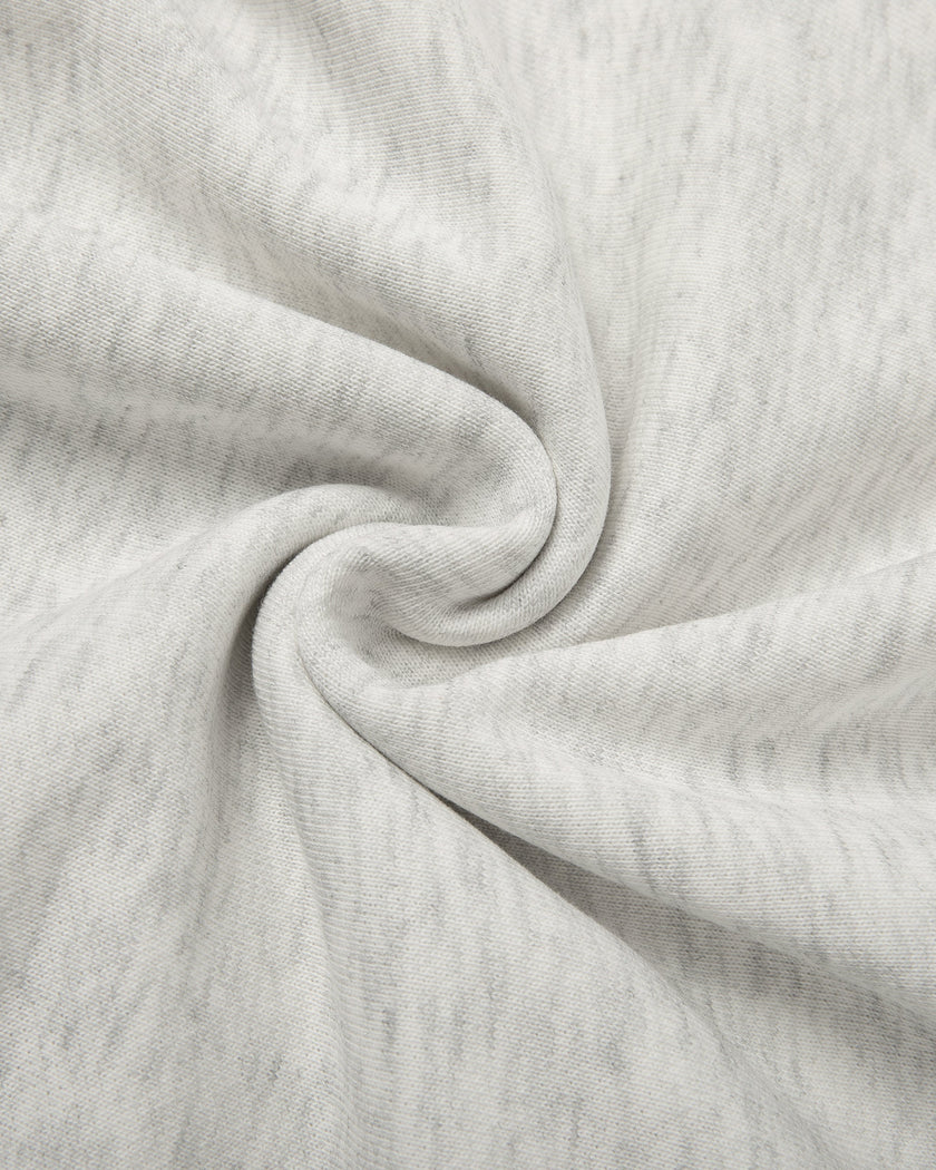 Detailed view of the premium knit texture on the Everyday Cropped Zip-Up Hoodie in Oat Gray