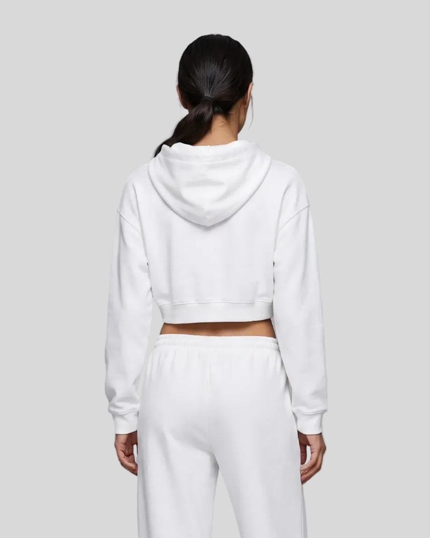 Back view of a model wearing the Everyday Cropped Zip-Up Hoodie in White