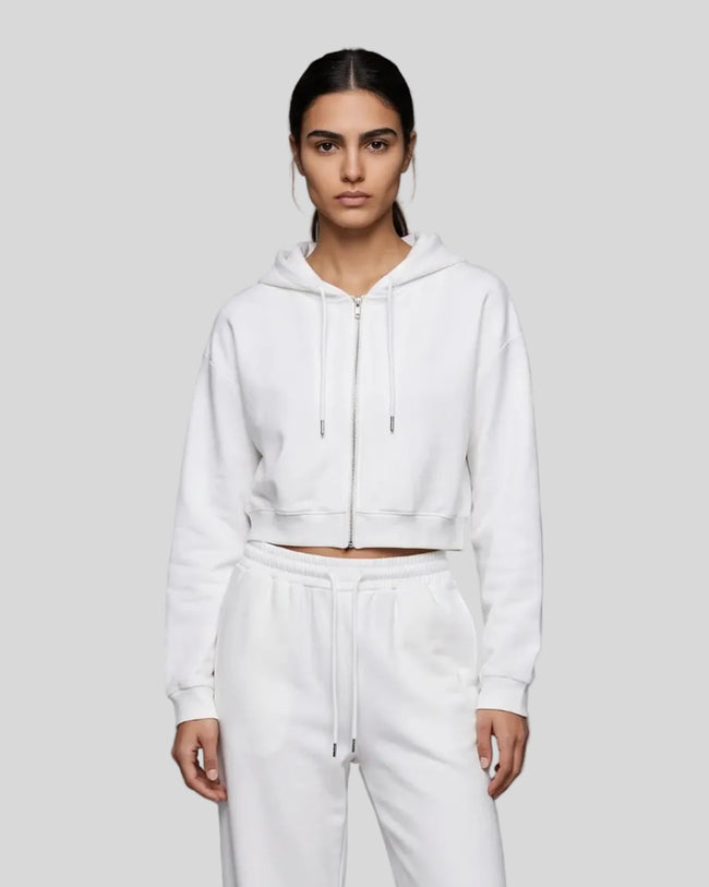 Model wearing the Everyday Cropped Zip-Up Hoodie in White viewed from the front