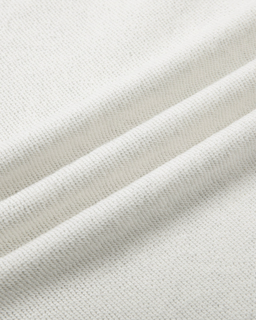 Close-up of the soft cotton-blend fabric on the Everyday Drawstring Skirt in Oat Gray