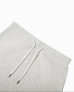 Close-up of the elastic waistband and adjustable drawstring on the Everyday Drawstring Skirt in Oat Gray