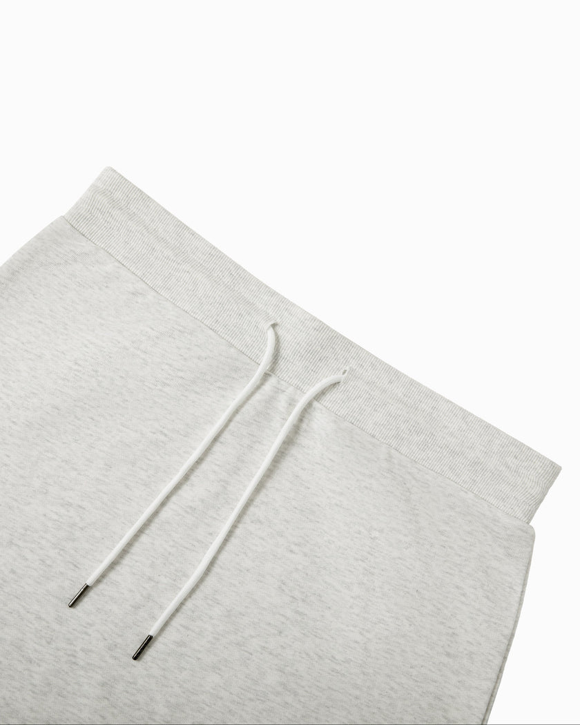 Close-up of the elastic waistband and adjustable drawstring on the Everyday Drawstring Skirt in Oat Gray