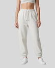 Model wearing Everyday Jogger Pants in Oat Gray front view