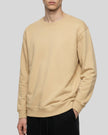 Upper body front angle view of man wearing Everyday Oversized Sweatshirt in Khaki