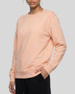 Upper body closer front angle view of woman wearing Everyday Oversized Sweatshirt in Pink