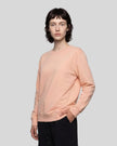 Upper body front angle view of woman wearing Everyday Oversized Sweatshirt in Pink