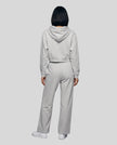 Full-body back view of a model wearing the Everyday Straight Leg Sweatpants in Flower Gray