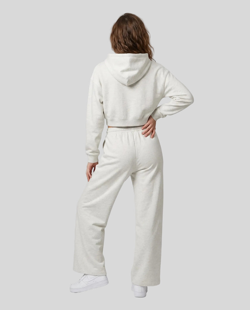 Full-body back view of a model wearing the Everyday Straight Leg Sweatpants in Oat Gray