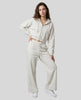 Full-body front view of a model wearing the Everyday Straight Leg Sweatpants in Oat Gray