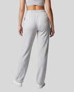 Back view of a model wearing the Everyday Straight Leg Sweatpants in Oat Gray