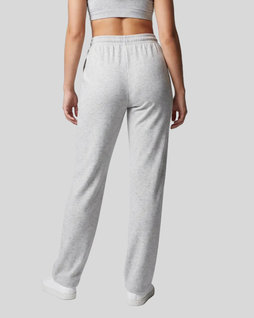 Back view of a model wearing the Everyday Straight Leg Sweatpants in Oat Gray