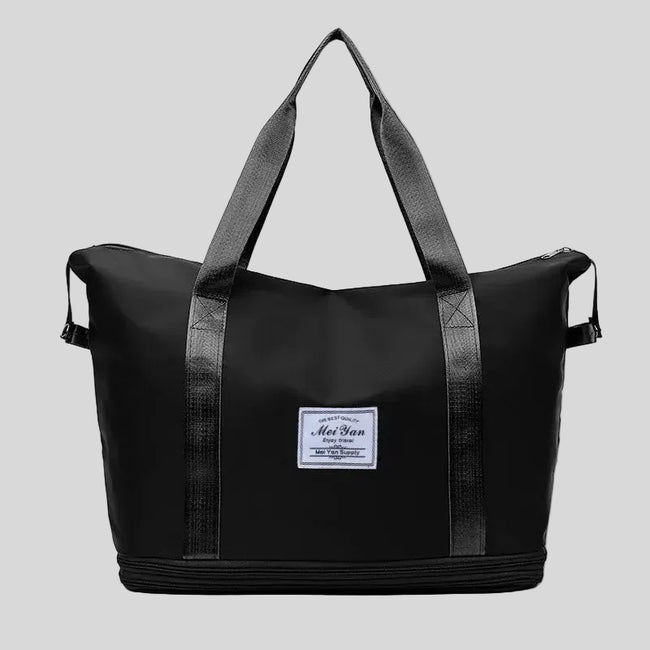 ExpandForm Weekender Bag in black front view with structured silhouette and dual handles