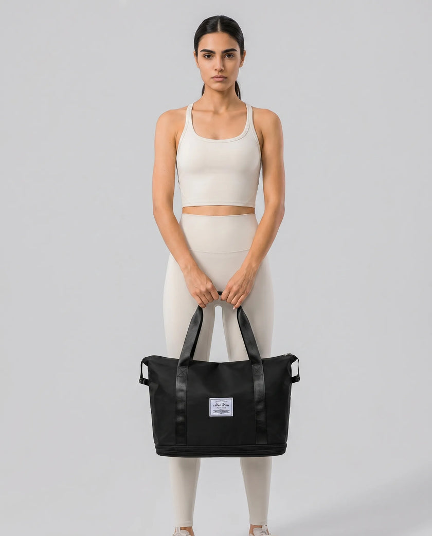 Model carrying ExpandForm Weekender Bag in black styled for studio sessions and everyday movements