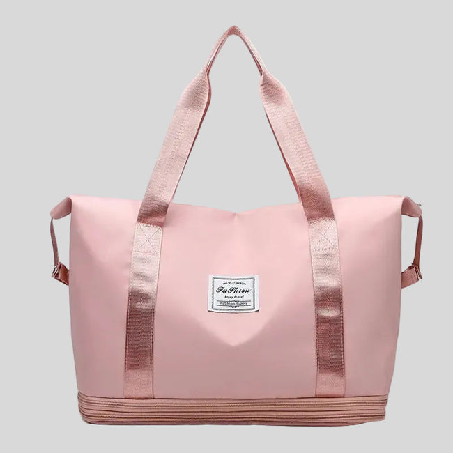 ExpandForm Weekender Bag in dusty pink front view with structured silhouette and dual handles
