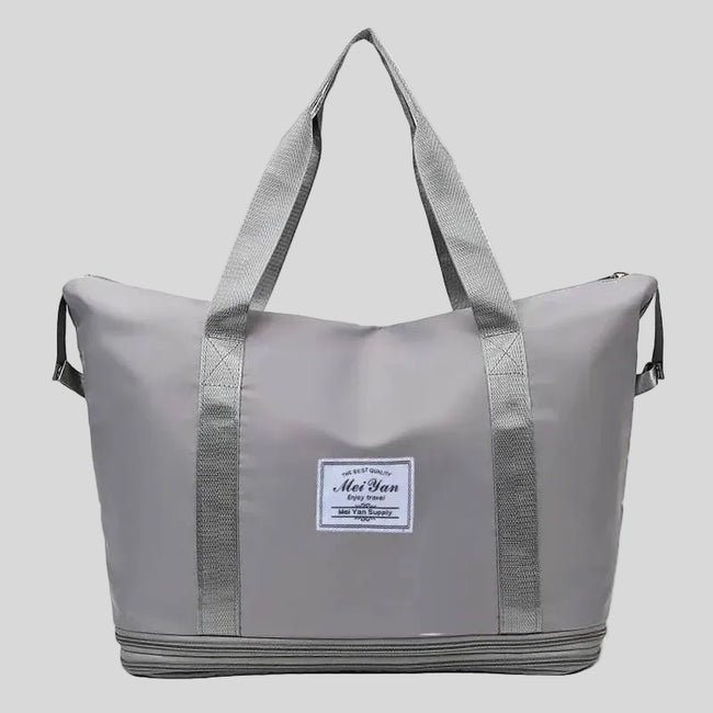 ExpandForm Weekender Bag in gray front view with structured silhouette and dual handles