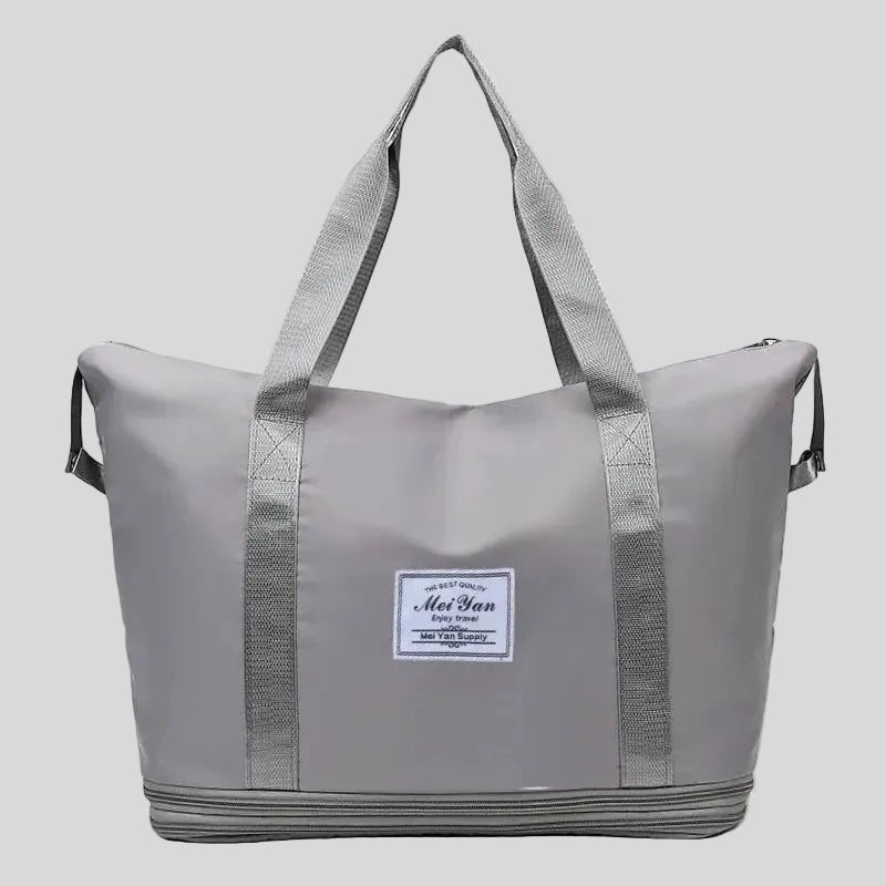 ExpandForm Weekender Bag in gray front view with structured silhouette and dual handles