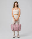 Model carrying ExpandForm Weekender Bag in Moonlit mauve styled for studio sessions and everyday movements