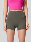 High-rise waistband of FlexRise High-Waist Short Legging in Deep Dark Green - Athlesi