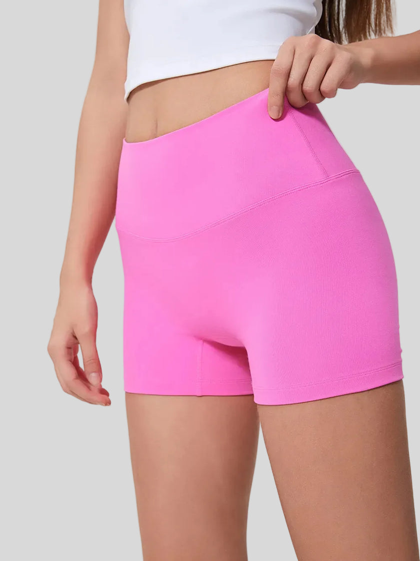 Smooth, stretchy fabric of FlexRise High-Waist Short Legging in Fuchsia Pink - Athlesi