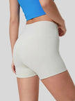 Clean, minimal design of FlexRise High-Waist Short Legging in White - Athlesi