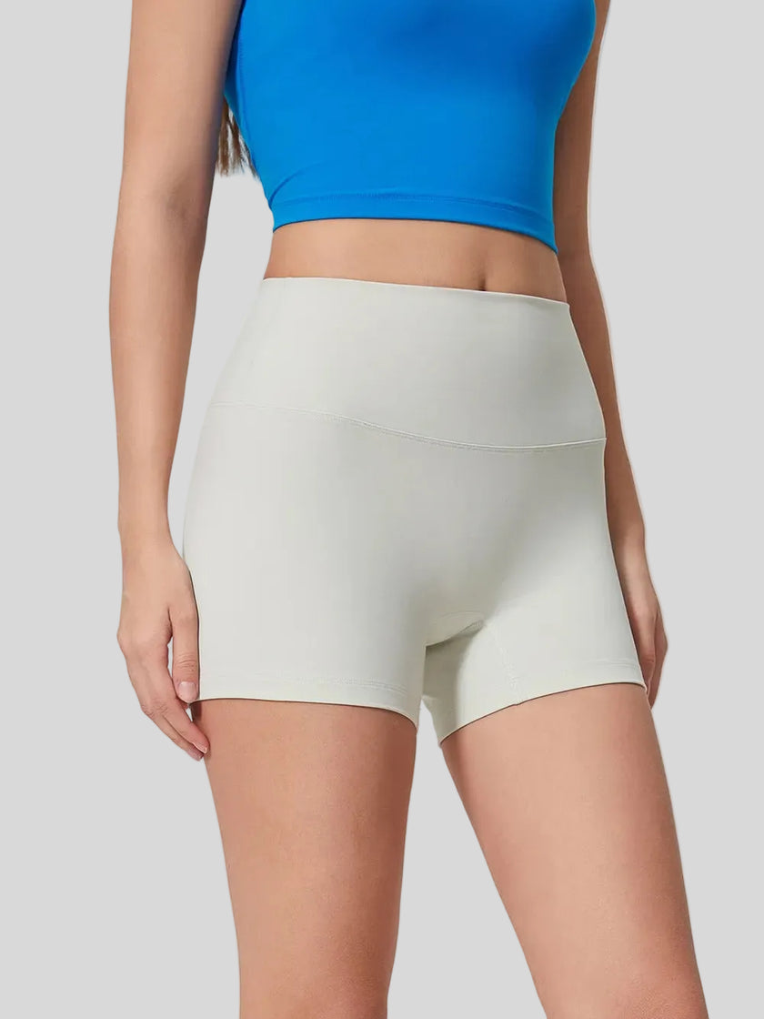 Smooth, stretchy fabric of FlexRise High-Waist Short Legging in White - Athlesi