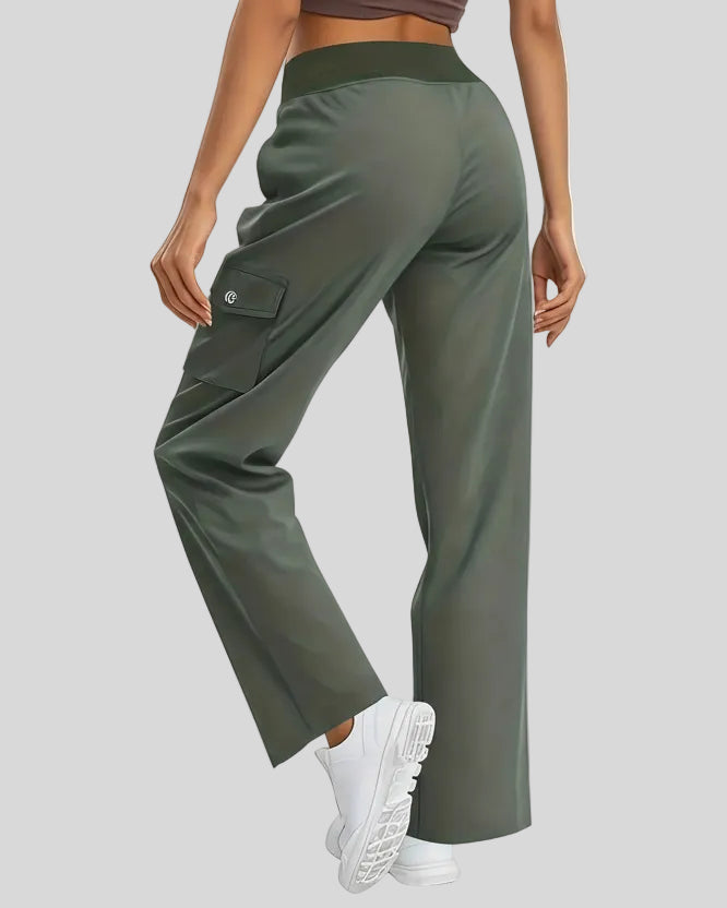 Back angled view of FlowCargo Relaxed Active Pants in Army Green showing relaxed silhouette and waistband fit