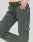 Close-up of drawstring waistband and front pocket detail on FlowCargo Relaxed Active Pants in Army Green