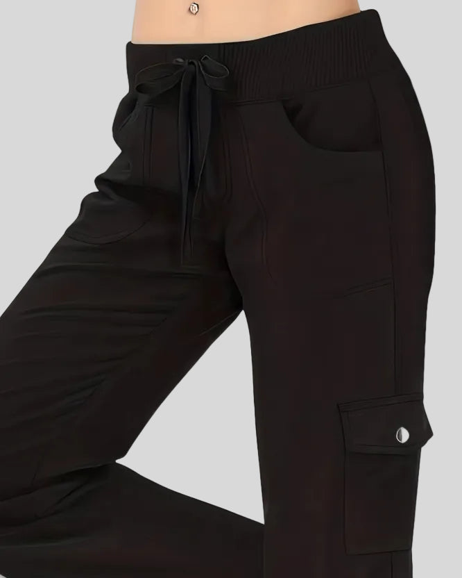 Close-up of drawstring waistband and front pocket detail on FlowCargo Relaxed Active Pants in Black
