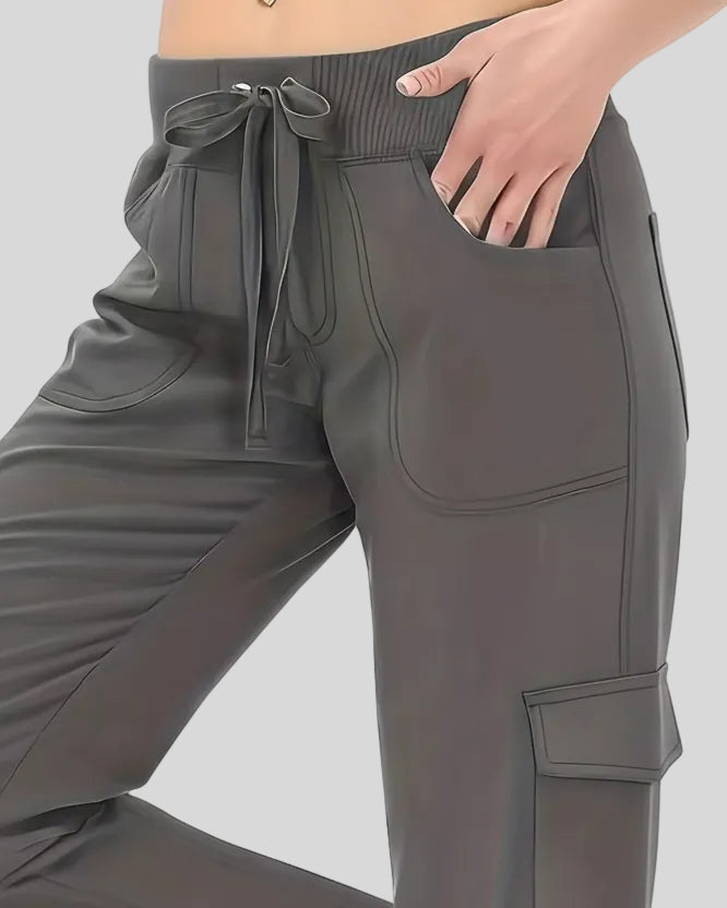 Close-up of drawstring waistband and front pocket detail on FlowCargo Relaxed Active Pants in Dark Gray