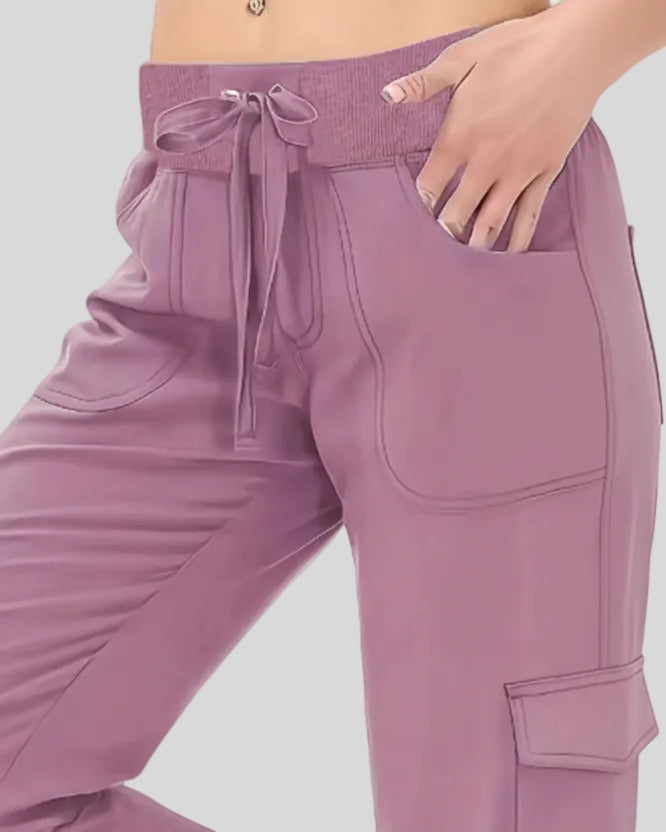 Close-up of drawstring waistband and front pocket detail on FlowCargo Relaxed Active Pants in Dusty Pink