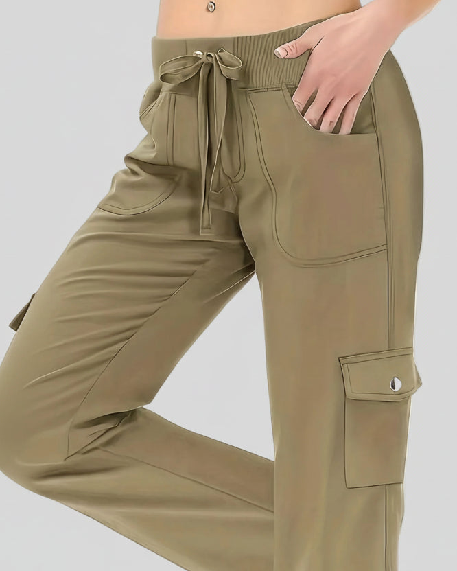 Close-up of drawstring waistband and front pocket detail on FlowCargo Relaxed Active Pants in Olive