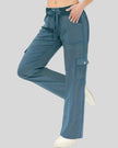 FlowCargo Relaxed Active Pants in Sea Blue shown from a front angled view with drawstring waist and relaxed fit.