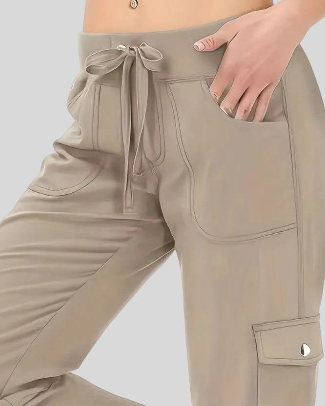 Close-up of drawstring waistband and front pocket detail on FlowCargo Relaxed Active Pants in Tan.