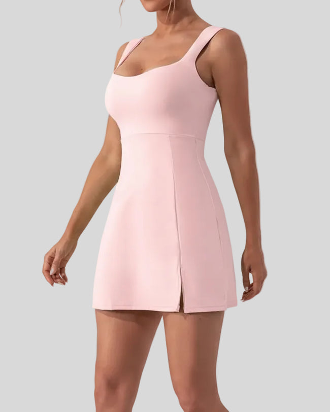 Side view of FlowCourt seamless active dress showing mini length and slit in dusty pink