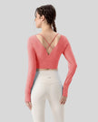 Athlesi FlowCross studio top in hot pink featuring crisscross back detail
