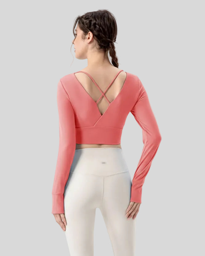 Athlesi FlowCross studio top in hot pink featuring crisscross back detail