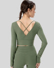 Athlesi FlowCross studio top in matcha green featuring crisscross back detail