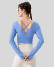 Athlesi FlowCross studio top in sky blue featuring crisscross back detail