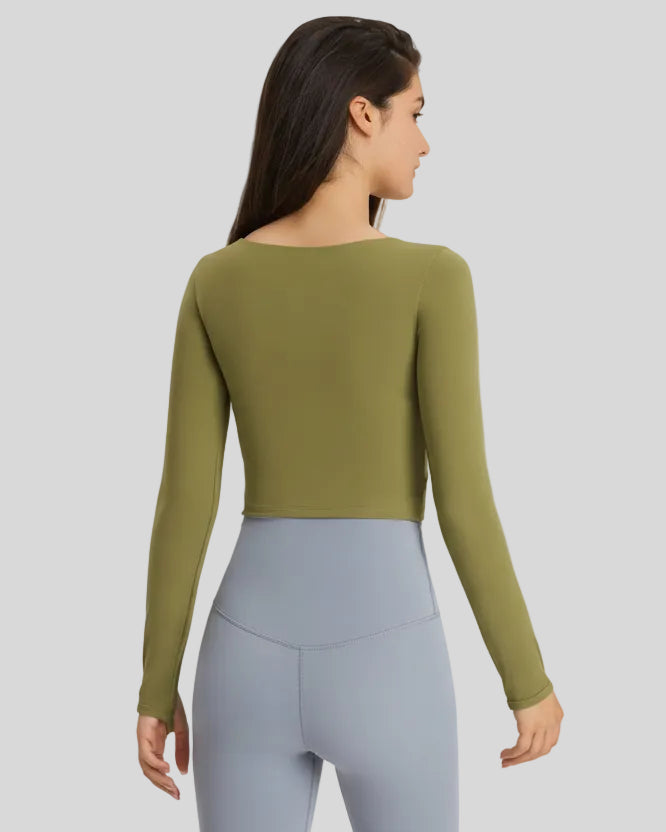 Back view of green FlowCut Studio Top with smooth long sleeves